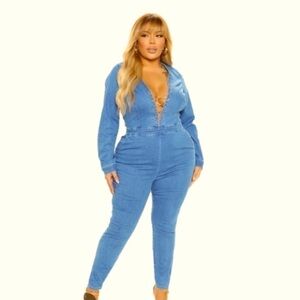 Denim jumpsuit long sleeves skinny legs. DeepV neck ,frontal chain .stretch .